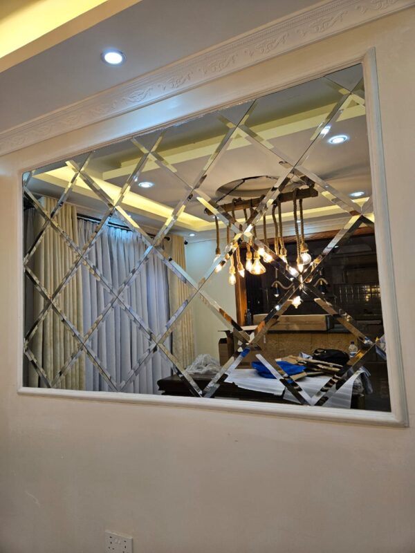 Elegant bevelled mirror panels reflecting light in a salon interior in Kenya