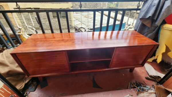 Durable handcrafted mahogany TV cabinet for living room setup